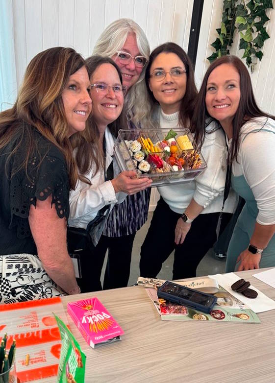 people holding a full snacklebox