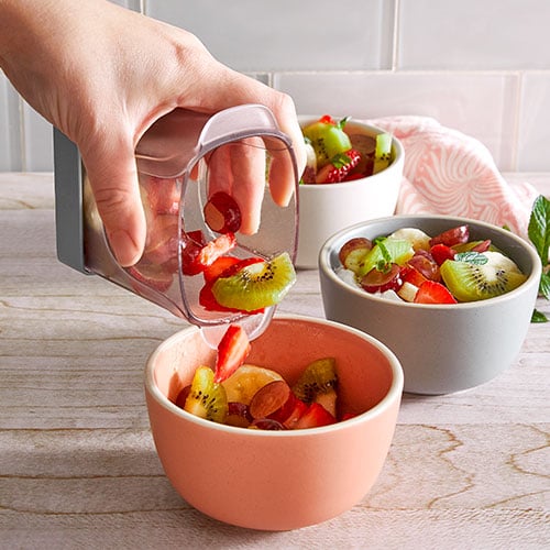 It's the cup slicer from pampered chef!! Make a quick fruit salad