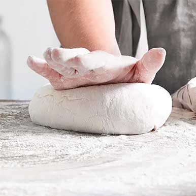 hand rolling dough